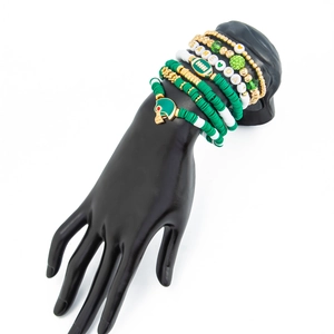 Detail of multi-layer Game Day bracelet set with green clay beads and football charms