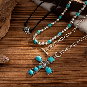 Bohemian jewelry set featuring turquoise floral and bull head cross pendant necklaces