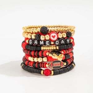 Detail of multi-layer Super Bowl bracelets with GAME DAY beads and rugby charms