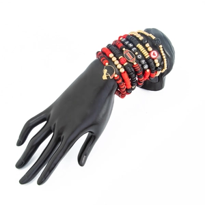 Close-up of Game Day bead bracelet set with football charms and red black gold accents