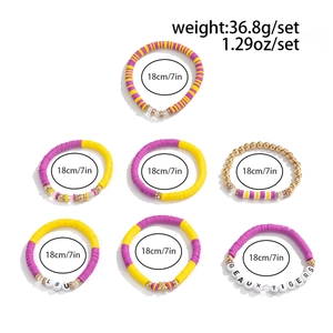 Set of 7 yellow and purple acrylic beaded bracelets with LSU logo and Geaux Tigers text