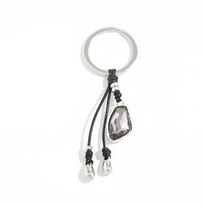 Irregular multifaceted gray crystal keychain with silver metallic beads and black woven rope