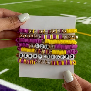 Detailed set of 7 LSU and Geaux Tigers themed beaded bracelets with purple and gold charms