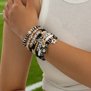 Close-up of football themed multi-layer beaded bracelet set with soccer jersey charm