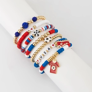 Detail of multi-layer soccer bracelets with USA beads and red jersey charms