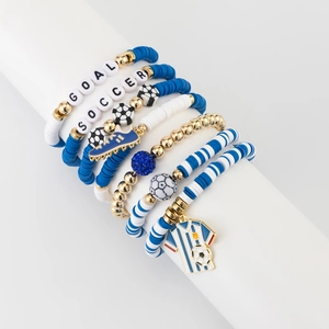 Detail of multi-layer soccer themed beaded bracelet set with goal and soccer letter charms