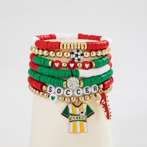 Detail of a 7-piece soccer-themed bracelet set with acrylic beads and sport charms