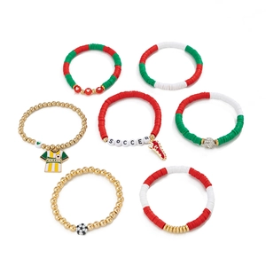 Detail of soccer themed bracelets with colorful heishi beads and gold charms