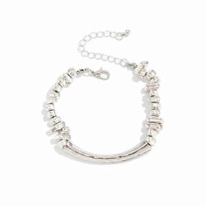 Irregular silver beaded necklace with metallic curved tube on white background