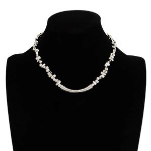 Detail of silver beaded necklace with cross pendant on black bust mannequin display