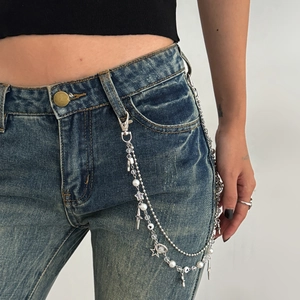 Detail of multi-layered silver hip-hop pants chain with faux pearls and star charms