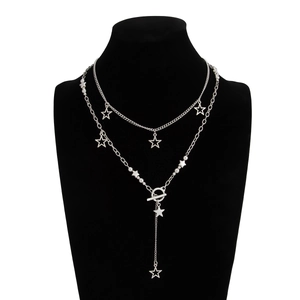Close-up of double-layered silver star pendant necklace with T-bar clasp on a black bust