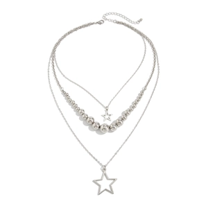 Close-up of triple-layered silver star necklace with metallic beads and hollow pendants