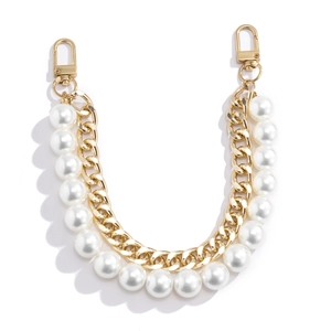 Close-up of double-layer bag chain with gold metal links and white faux pearls