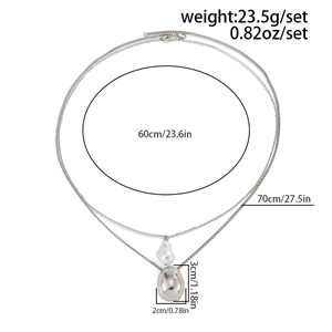 Detailed view of silver double-layered necklace showing dimensions and pearl pendant detail