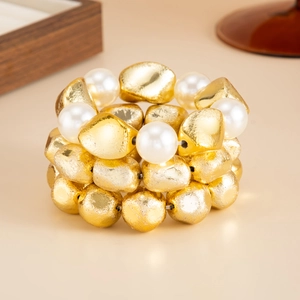 Minimalist elastic beaded bracelet with textured gold beads and white faux pearls