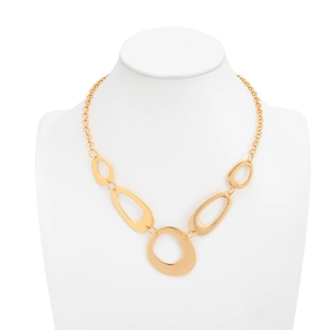 Statement gold-toned metal chain with asymmetrical oval rings on a display bust
