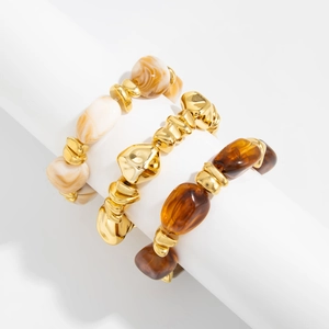 Detailed set of three irregular beaded bracelets with resin and metallic gold finishes