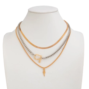 Close-up of triple-layered necklace with snake chain, U-lock link and lightning bolt charm