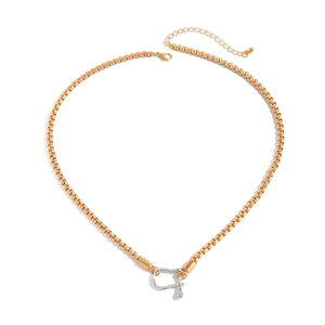 Detail of gold square chain with silver U-shaped clasp and adjustable lobster hook