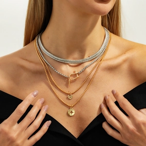 Three-layer layered necklace set with horseshoe U-buckle chains and compass star pendants