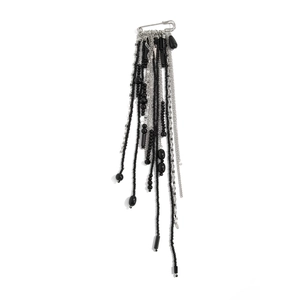 Silver safety pin brooch with hanging black beads and tassel chains on white background