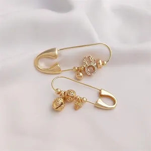 14K gold plated brooch pins with reindeer and hollow bead charms on white silk