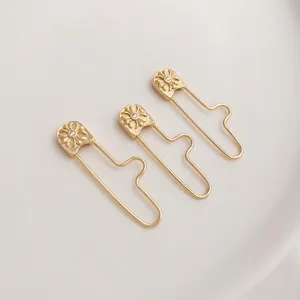 Three 14K gold plated safety pin pendants with daisy relief for DIY jewelry making