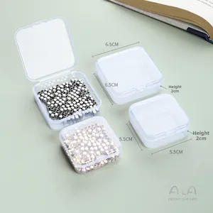 Detail view of small clear plastic storage boxes showing two sizes for jewelry beads