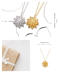 Detailed view of gold and silver daisy necklaces with layered petals and gift packaging