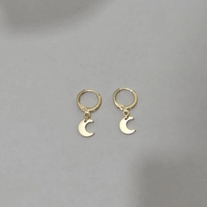 Detailed view of golden crescent moon earrings with S925 sterling silver hallmarks