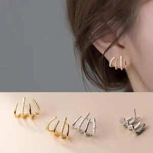Elegant gold and silver four-row crystal stud earrings with minimalist claw design