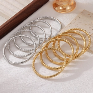 Minimalist flexible spiral texture bangles in gold and silver finish for stacking