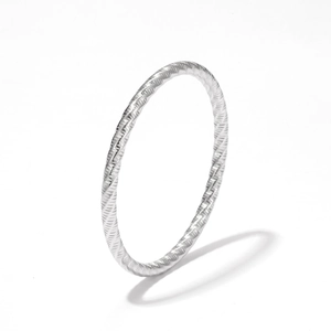Minimalist silver textured bangle featuring a polished wheat pattern and flexible design