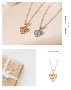 Detail of heart leaf pendant necklaces in gold and silver finish with gift packaging