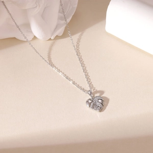 Sparkling zircon heart-shaped leaf pendant on a silver stainless steel necklace