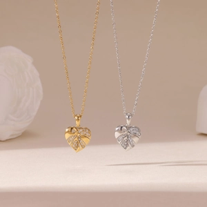 Titanium steel heart pendant necklaces in gold and silver with hollow leaf vein textures