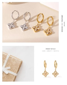 Detalle de pendientes de trébol en oro y plata con cristales brillantes de alta calidad
