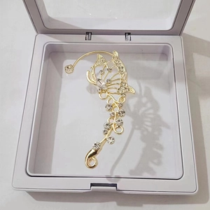 Elegant gold butterfly ear cuff with hollow design and sparkling zircon stone accents