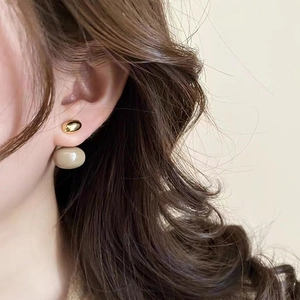 Vintage caramel glaze double drop earrings shown on a model with a retro aesthetic
