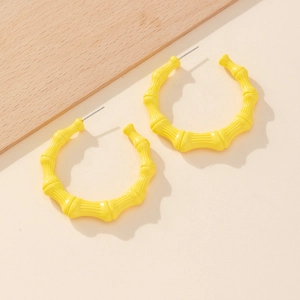 Chic yellow bamboo-style C-shape hoop earrings with artistic metal lacquer finish