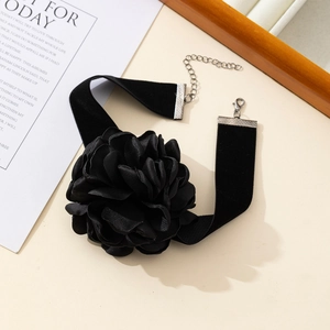 Elegant black velvet choker featuring a 3D satin rose flower and adjustable silver chain