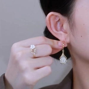 Elegant gold drop earrings with green cat-eye stones and matching flower ring for women