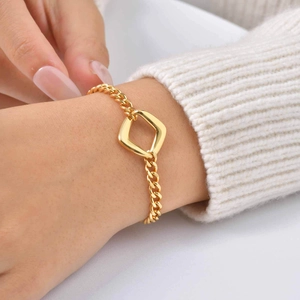 Women 18K gold plated chunky Cuban link bracelet with hollow square charm on wrist