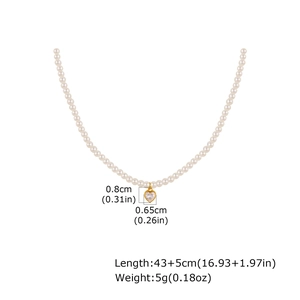Vintage gold stainless steel necklace with white pearls and a heart zircon pendant