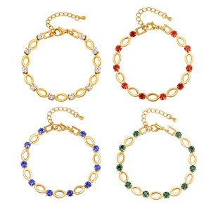 Gold-plated stainless steel bracelet with oval hollow links and multi-color rhinestones