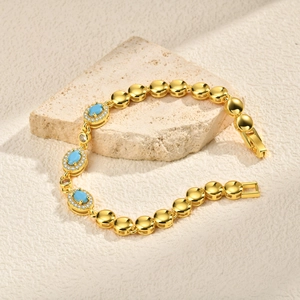 Elegante bracciale placcato oro 24K con pietre blu ovali e scintillanti accenti di zircone