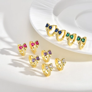 Elegant gold bow earrings set with heart-shaped colorful zircons in five vibrant colors