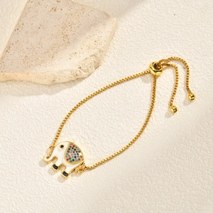 Detail of gold elephant bracelet with colorful zircons and adjustable box chain