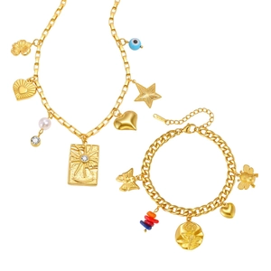 Ensemble collier et bracelet en acier doré avec breloques œil et étoiles